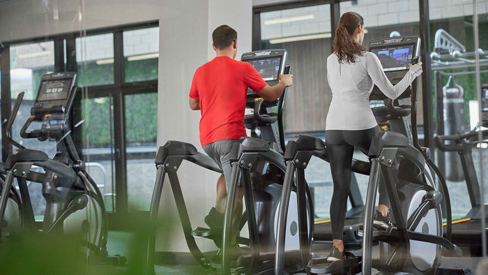 male and female using matrix elliptical - lifestyle
