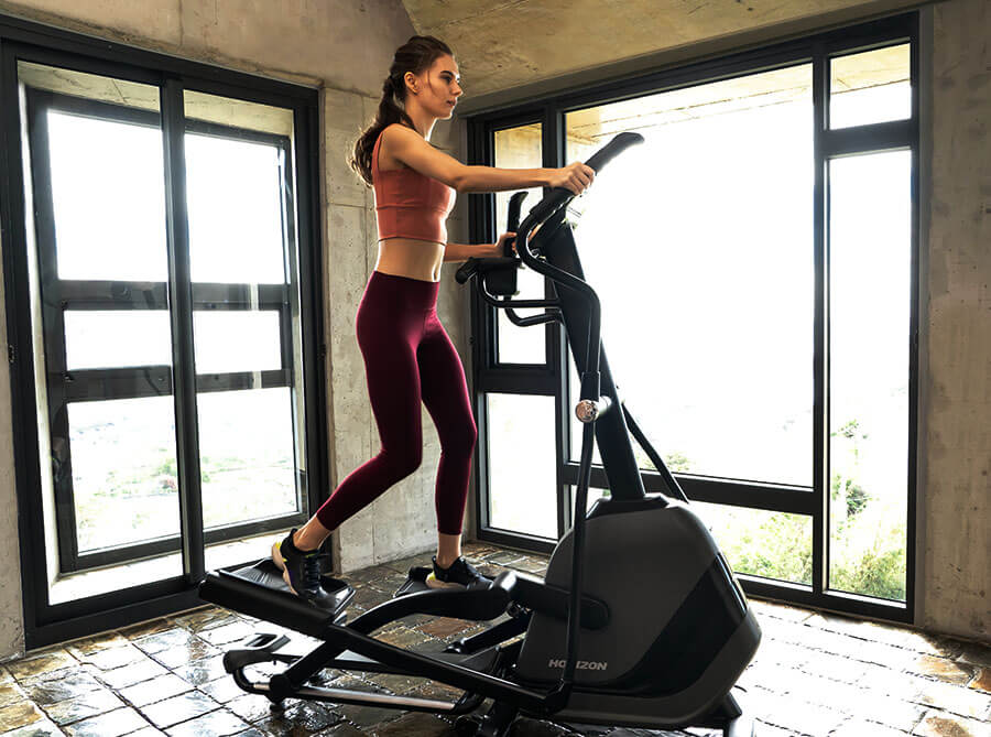 horizon elliptical - woman indoor