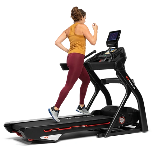 woman in yellow running on bowflex treadmill png