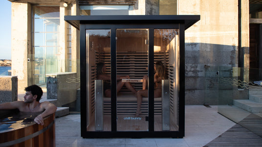 chill bunny outdoor sauna - two women - ice bath to left hand side