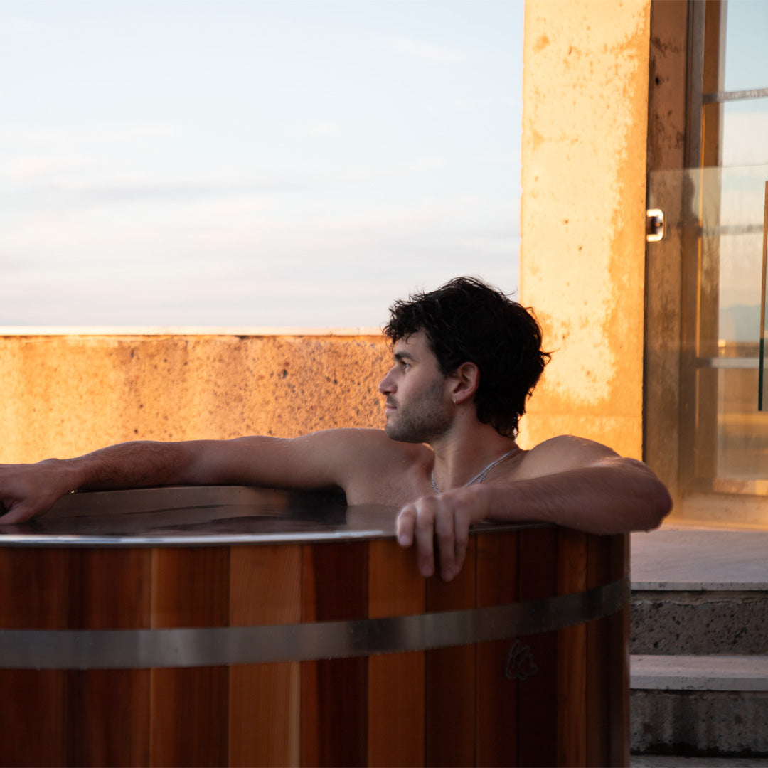 man in chill bunny ice bath - outdoors