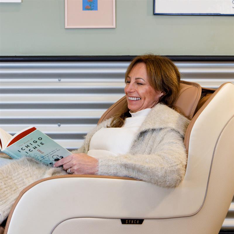 female sitting in synca circ plus massage chair 